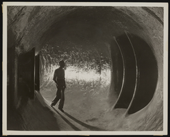 Photograph of a man in a tunnel, Hoover Dam, approximately 1931-1936
