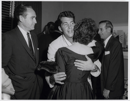 Photograph of Dean Martin greeting guests in his dressing room at the Sands, Las Vegas, March 6, 1957