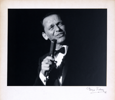 Photograph of Frank Sinatra singing onstage in the Copa Room, the Sands Hotel, Las Vegas, 1960