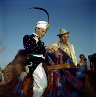 Film transparency of Frank Sinatra in Arabian costume and on a camel for the grand opening of the Dunes Hotel, Las Vegas, 1955