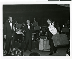 Photograph of Dean Martin and Frank Sinatra having fun onstage in the Copa Room at the Sands Hotel, Las Vegas, 1967