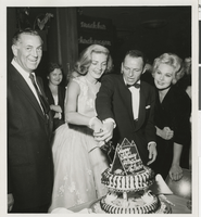 Photograph of Jack Entratter, Lauren Bacall, Frank Sinatra, and Kim Novak celebrating Bacall's birthday, Sands Hotel, Las Vegas, circa 1950s