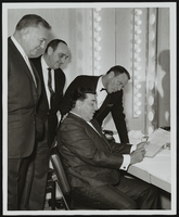 Louis Prima signing his contract at the Sands Hotel: photographs