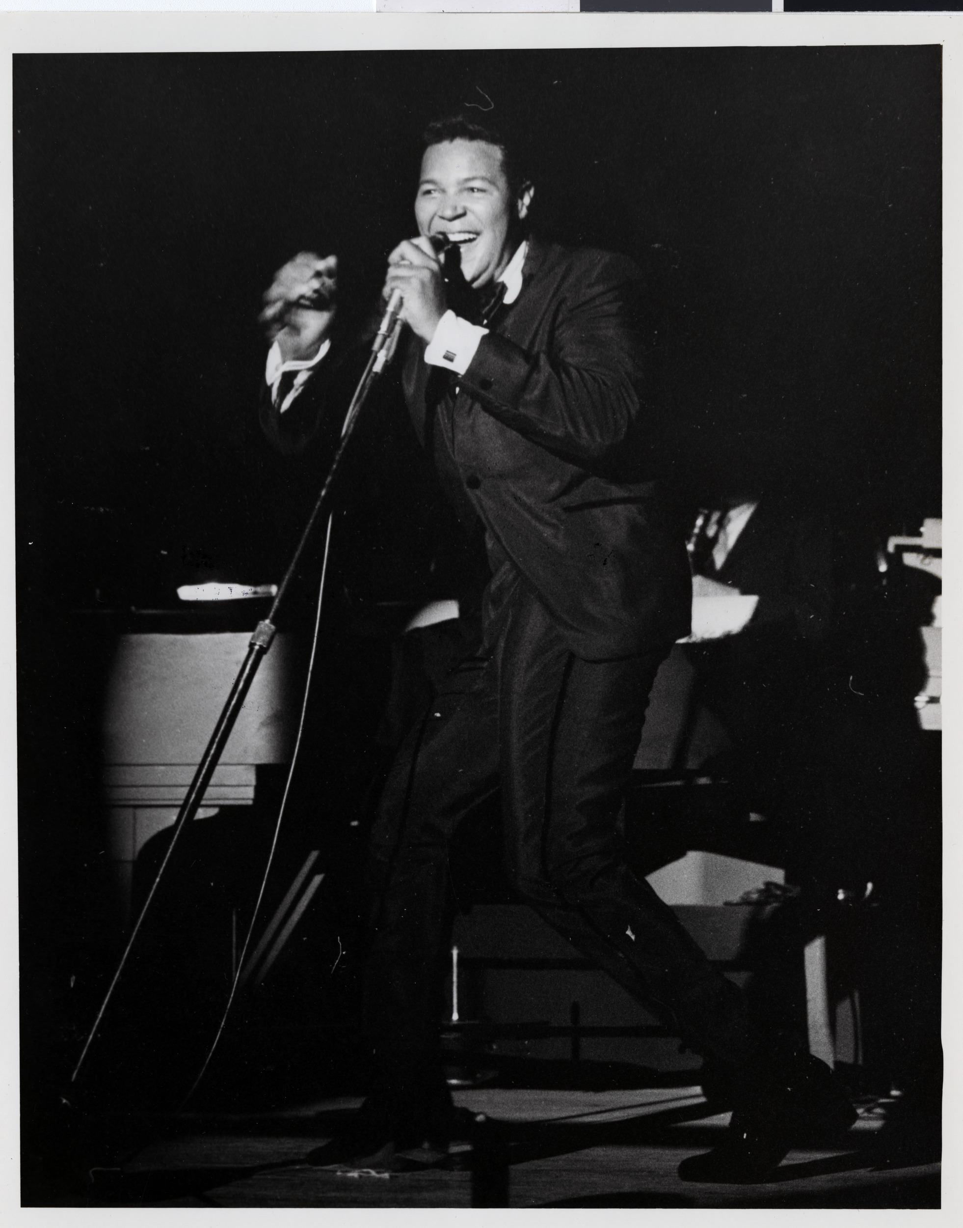 Photograph of Chubby Checker performing onstage at the Sands Hotel, August 1962