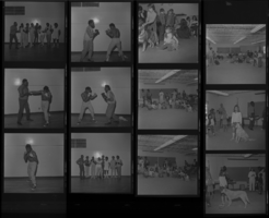 Set of negatives by Clinton Wright including Basketball tournament girls at Doolittle, Bonanza School Pet Show, boxing team at Doolittle, and Welfare Rights march on Strip, 1971