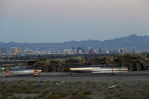 Construction equipment along 215 the Beltway in the Nortwest with the Las Vegas skyline, Las Vegas, Nevada: digital photograph