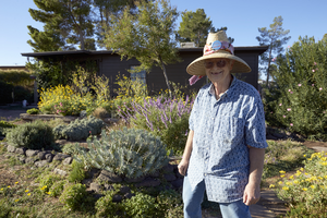 Adrianne Ruefa tends her garden at an original townsite home, Henderson, Nevada: digital photograph