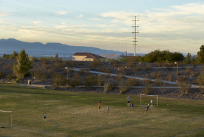 Soccer practice in the Anthem Hills Park detention basin, Henderson, Nevada: digital photograph