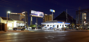 Arco AM/PM dwarfed by mega casino properties, Las Vegas, Nevada: digital photograph