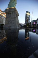 New York New York hotel and casino and MGM Grand sign reflected in water, Las Vegas, Nevada: digital photograph