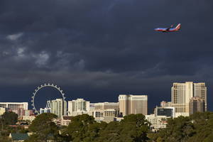 Airplane and storm clouds over Las Vegas Strip, Las  Vegas, Nevada: digital photograph