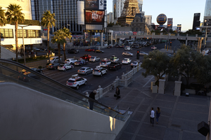 Tourists using overpass on the Las Vegas Strip, Las Vegas, Nevada: digital photograph
