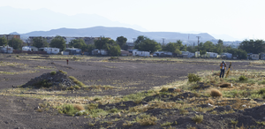 Surveyor working in Cadence vacant land, Henderson, Nevada: digital photograph