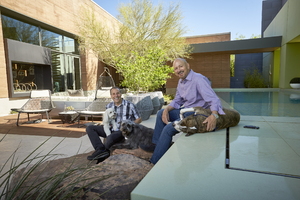 Architects Jon Sparer and John Klai with dogs at home, Las Vegas, Nevada: digital photograph