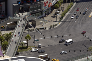 Pedestrians walking along a Las Vegas Strip footbridge from above, Las Vegas, Nevada : digital photograph