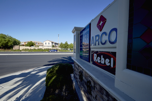 Rebel Arco sign looking west towards single family housing in Summerlin, Las Vegas, Nevada: digital photograph
