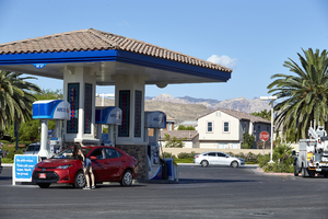Gas station with single family homes in the background, Las Vegas, Nevada: digital photograph