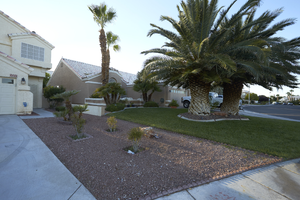 Single family residences with desert landscaping and grass near West Sahara Avenue, Las Vegas, Nevada: digital photograph