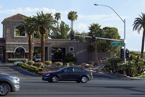 Canyon Gate entrance with traffic on West Sahara Avenue, Las Vegas, Nevada: digital photograph