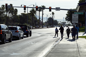 Pedestrians cross West Sahara Avenue at South Lake Sahara Drive, Las Vegas, Nevada: digital photograph