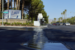 Water runoff on West Sahara Avenue in The Lakes development, Las Vegas, Nevada: digital photograph
