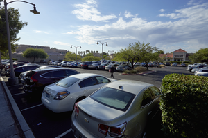 Cars in a parking lot for The Lakes Busines Park off West Sahara Avenue near South Durango Drive, Las Vegas, Nevada: digital photograph