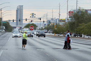 Crossing guard works on West Sahara Avenue west of South Valley View Boulevard looking east, Las Vegas, Nevada: digital photograph