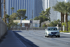 Jaywalker and traffic on Joe W Brown Drive looking south, Las Vegas, Nevada: digital photograph