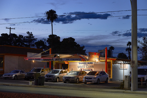 Sahara Auto Sales on East Sahara Avenue near 17th Street looking northwest at dusk, Las Vegas, Nevada: digital photograph