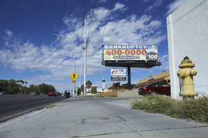 Sidewalks and billboards along East Sahara Avenue near Chapman Drive looking west, Las Vegas, Nevada: digital photograph