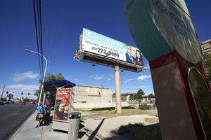 Billboard and bus stop on East Sahara Avenue looking west, Las Vegas, Nevada: digital photograph