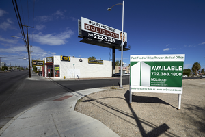 Signs on vacant lot on East Sahara Avenue at San Jose Avenue looking west, Las Vegas, Nevada: digital photograph