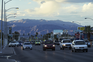 Traffic on South Eastern Avenue with mountains in background looking north at dusk, Las Vegas, Nevada: digital photograph