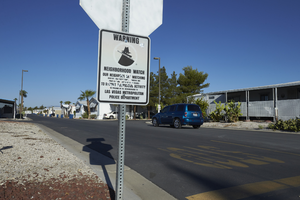 Neighborhood Watch sign in the Maycliff Senior Mobile Home Part off East Sahara Avenue at Sandhill Road looking west, Las Vegas, Nevada: digital photograph