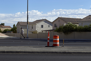 Pedestrian on East Sahara Avenue and Sandhill Road with homes looking north, Las Vegas, Nevada: digital photograph