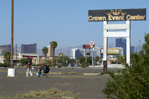 Homeless man at former Crown Event Center commercial property on East Sahara Avenue at Boulder Highway looking west, Las Vegas, Nevada: digital photograph
