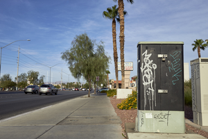 Graffiti covered utility box on West Sahara Avenue east of Decatur Boulevard looking west, Las Vegas, Nevada: digital photograph