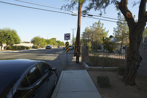 Sidewalk and ranch housing on Red Rock Street, looking north, Las Vegas, Nevada: digital photograph