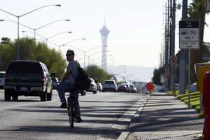 Bicyclist and cars on West Sahara Avenue east of Jones, looking east, Las Vegas, Nevada: digital photograph