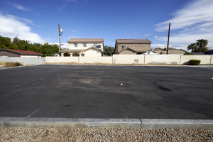 A Parking lot and single famly homes, looking north, Las Vegas, Nevada: digital photograph