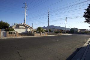 Single family homes and power lines off Sloan Lane south of East Sahara Avenue, looking northeast, Las Vegas, Nevada: digital photograph