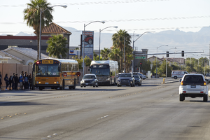 School bus loading on Sloan Lane north of East Sahara Avenue, looking south, Las Vegas, Nevada: digital photograph