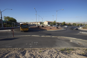 School bus using the roundabout that makes up the intersection of East Sahara Avenue and Hollywood Boulevard, looking south, Las Vegas, Nevada: digital photograph