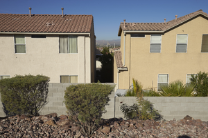 Singe family homes with the Stratosphere Tower in the distance, looking west, Las Vegas, Nevada: digital photograph