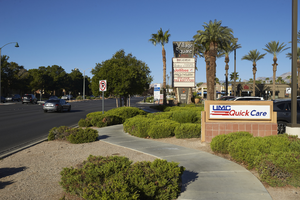 Singage and landscaping at the Village Square shopping center, looking west, Las Vegas, Nevada: digital photograph