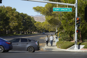 Pedestrians on Lake North Drive at Fort Apache Road, looking west, Las Vegas, Nevada: digital photograph