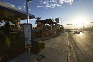 Bus stop in front of a gas station, store and car wash on West Sahara Avenue and Buffalo Drive, looking east, Las Vegas, Nevada: digital photograph
