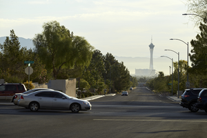 Traffic and the Stratosphere Tower in the distance as seen from Via Olivero Avenue, looking east, Las Vegas, Nevada: digital photograph