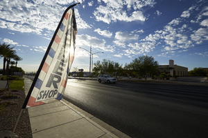 Barber shop advertisement West Sahara Avenue east of Buffalo Drive, looking west, Las Vegas, Nevada: digital photograph