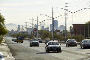 Cars on West Sahara Avenue east of Buffalo Drive with power lines and part of the Strip, looking east, Las Vegas, Nevada: digital photograph